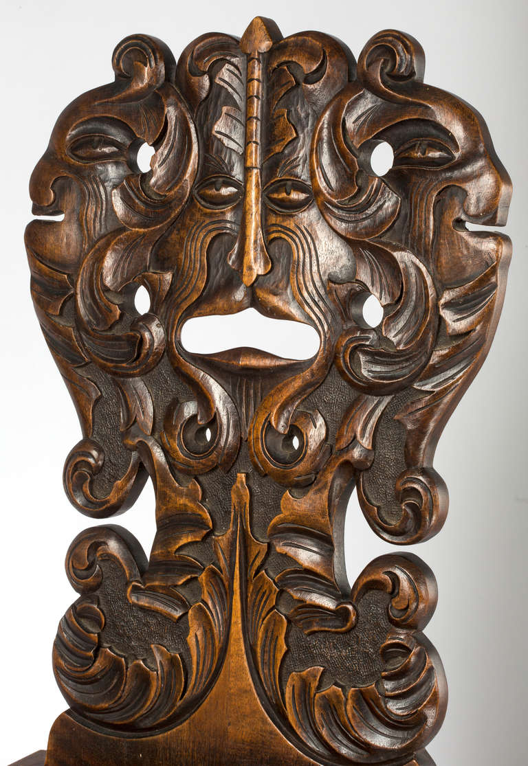 Walnut Pair of Carved Face Hall Chairs