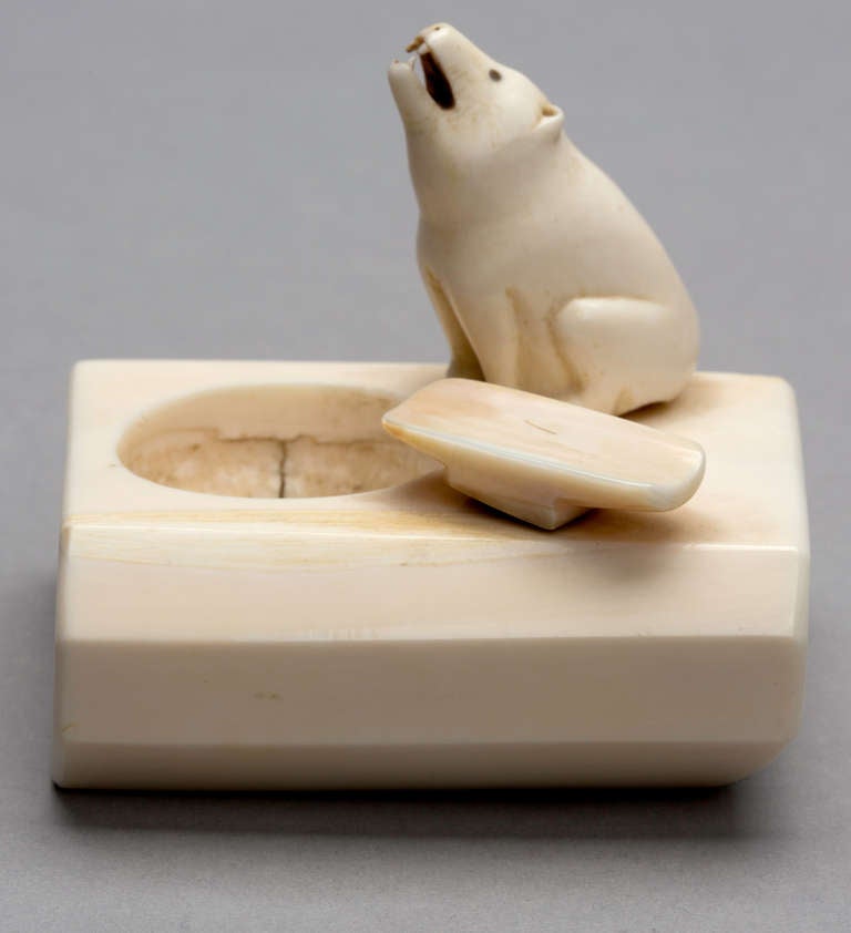 From early 1900s, Alaskan folk art.  Carved from walrus tusk ivory, howling wolf ashtray.  In wonderful condition.