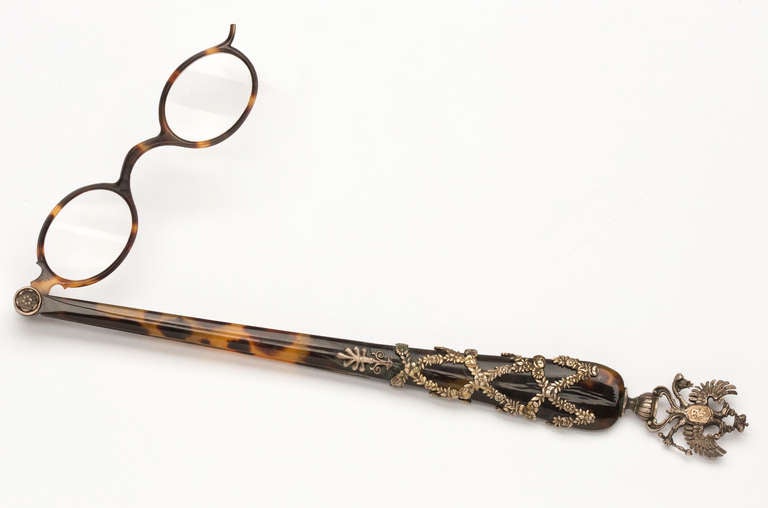 Exceptionally well preserved jeweled Russian Lorgnette.   Handle is solid tortoise shell, decorated with sterling silver twined floral design, finished with double eagle at the end.