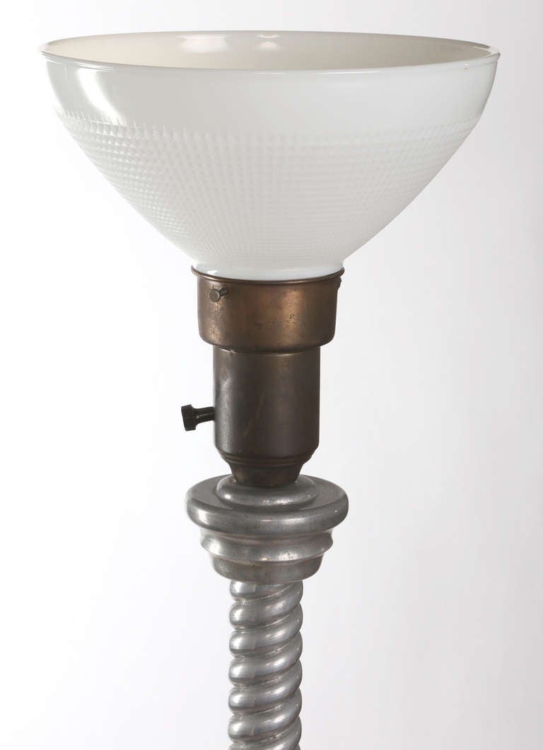 Heavy cast aluminum twist design,  floor lamp from the 1950s.  
Very handsome and functional, beautiful craftsmanship.