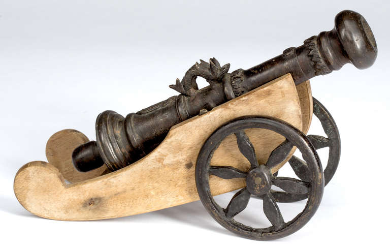 Miniature iron and wood cannon.  Decorative for desk or book shelves.