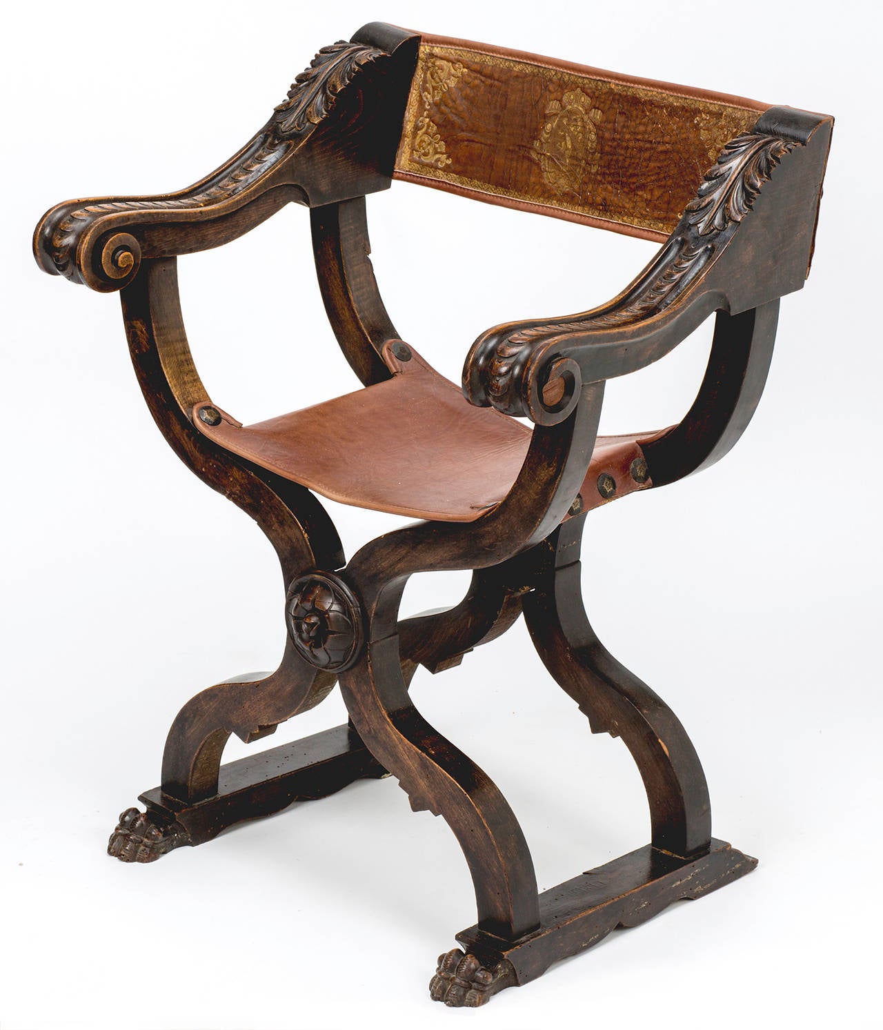 Italian, circa 1870s, beautiful pair of Savonarola style chairs. Leather strap seats and leather backs. Black leather strap is embossed in gold leather tooling. Beautifully carved wood frames. Wood patina is warmly aged over the years.
Seat straps