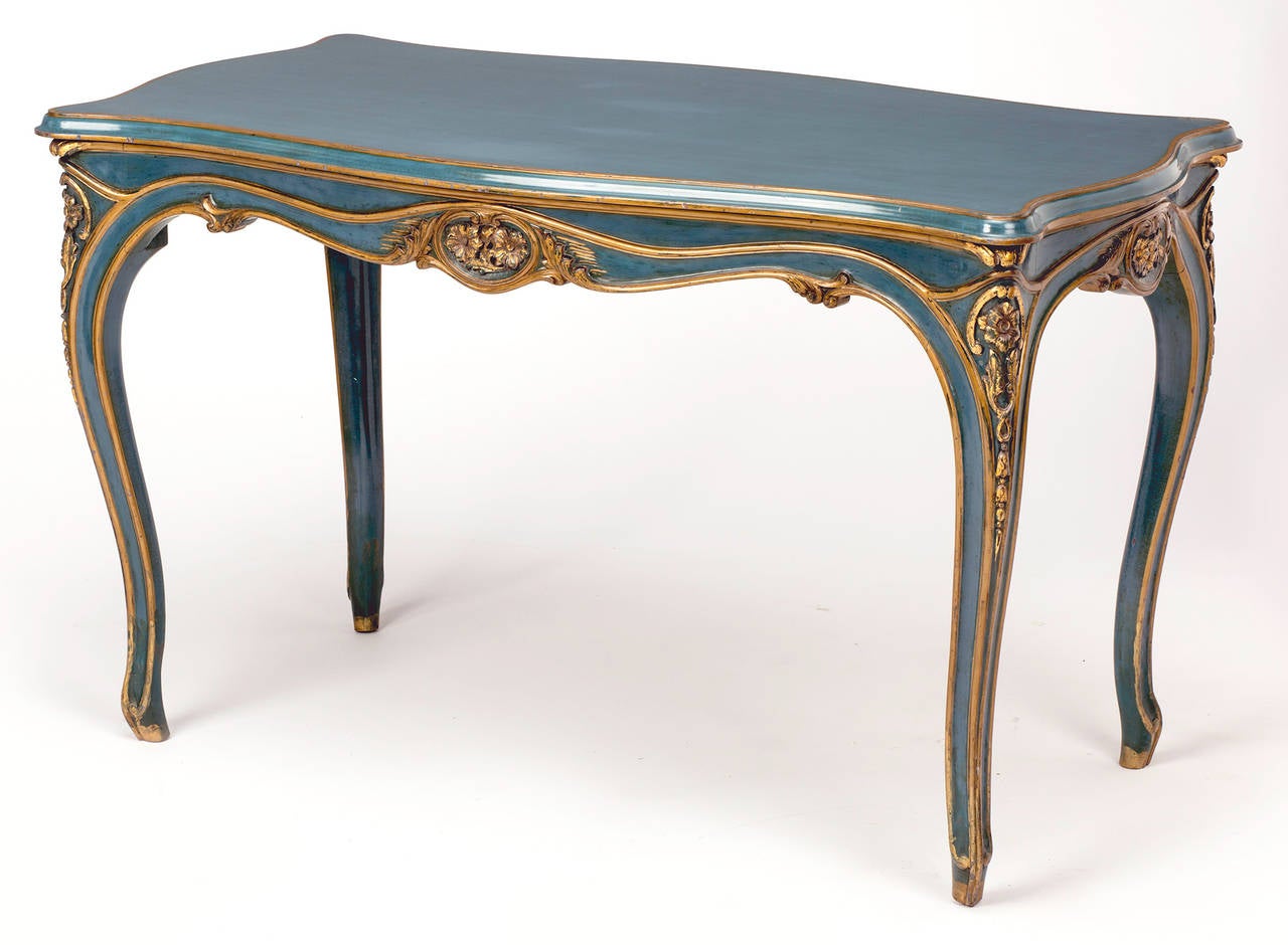 Wonderful French blue and gilt trim carved table.  Beautifully detailed carvings, graceful cabriole legs.  Suitable as center table.