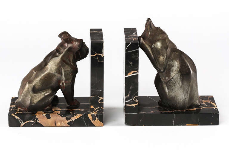 Very charming metal cast dog and cat book ends on marble stand.  Signed Irenee Rochard, French sculptor 1906-1984.