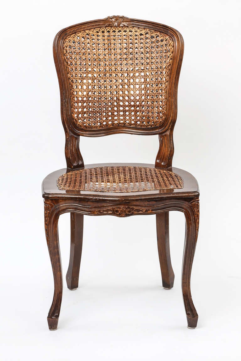 Charming carved Country  French cane chairs.  Double cane back and single cane seats. Sturdy comfortable chairs.