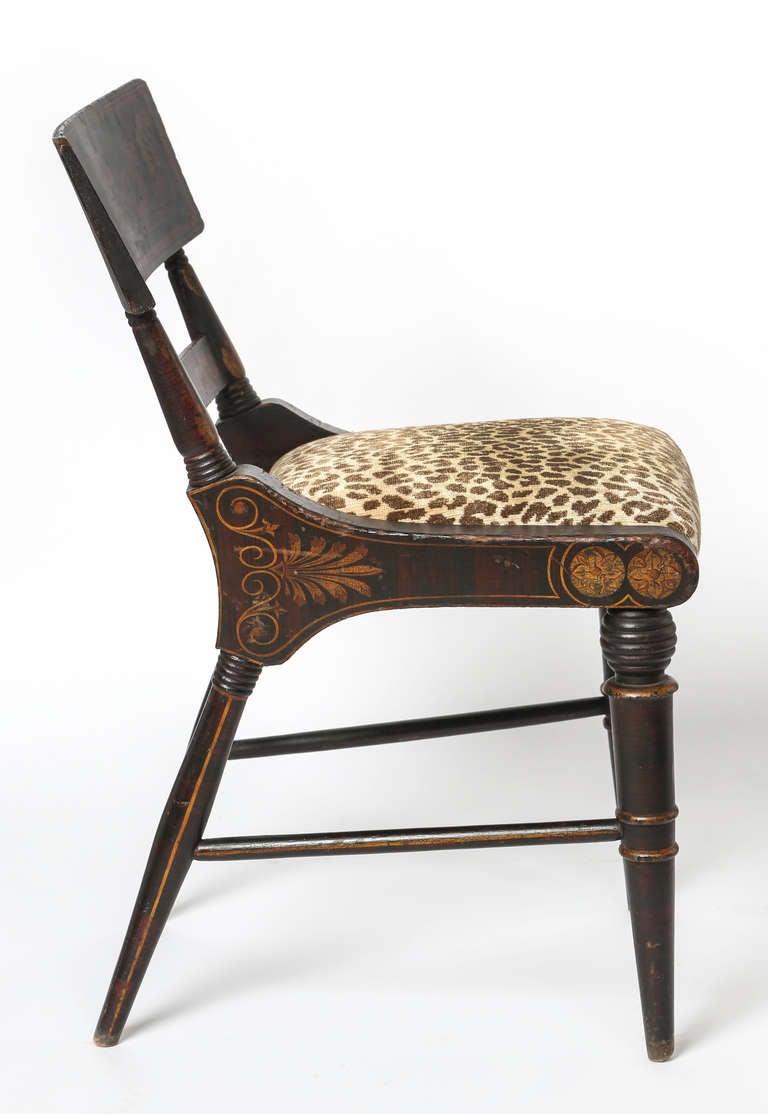 Set of four chairs, newly upholstered in silk and linen Leopard velvet.  Original painted gilt finish from the early 1800s.  Very sturdy comfortable chairs that has been updated beautifully!