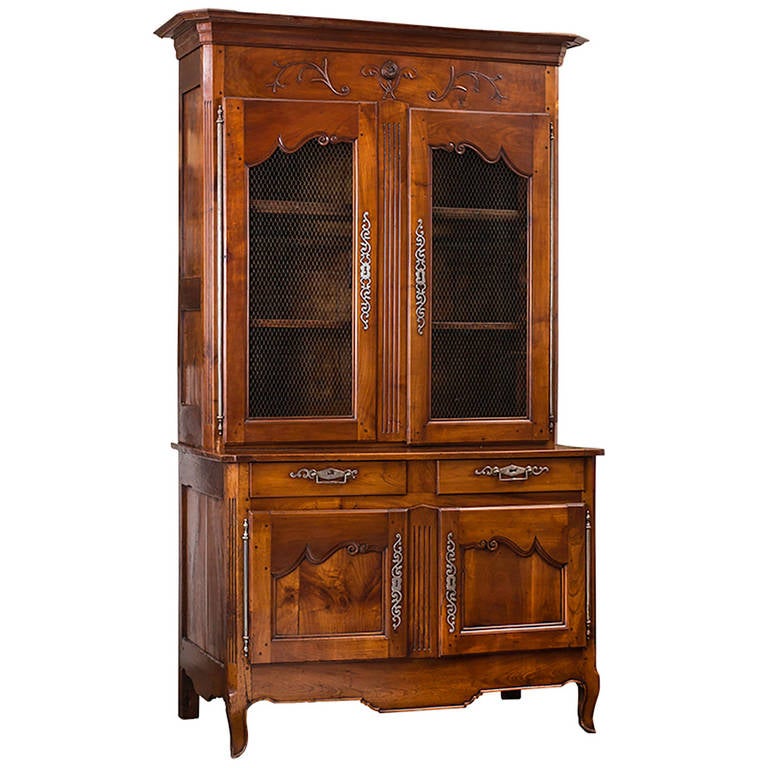 Beautifully handmade two-piece solid cherrywood cabinet. Upper cabinet has chicken wire panel doors for displaying china or books. There are added interior lights. Lower cabinet has two drawers and large storage area with beautiful set of panel