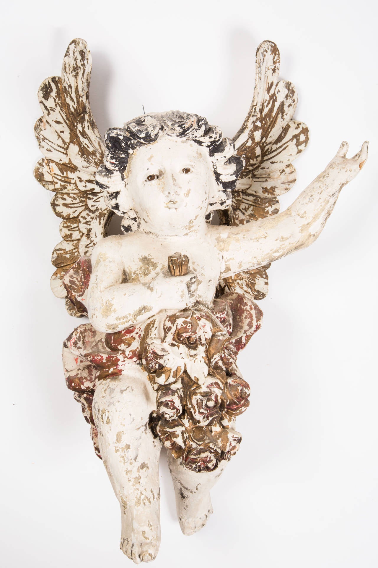 Charming painted wood carved cherubs.
Nice painted patina with glass eyes. Proper pair with opposite arms welcome open.