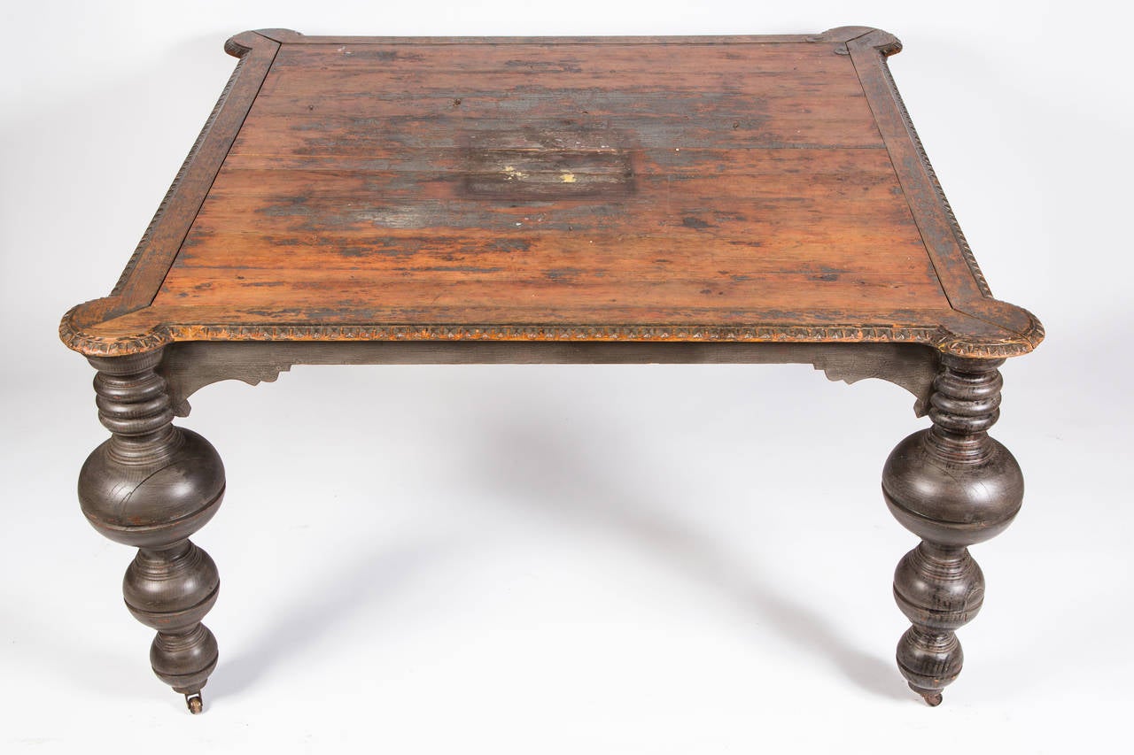 Large square table with dramatic bulbous legs. All four corners are scalloped.
Great working or display table.