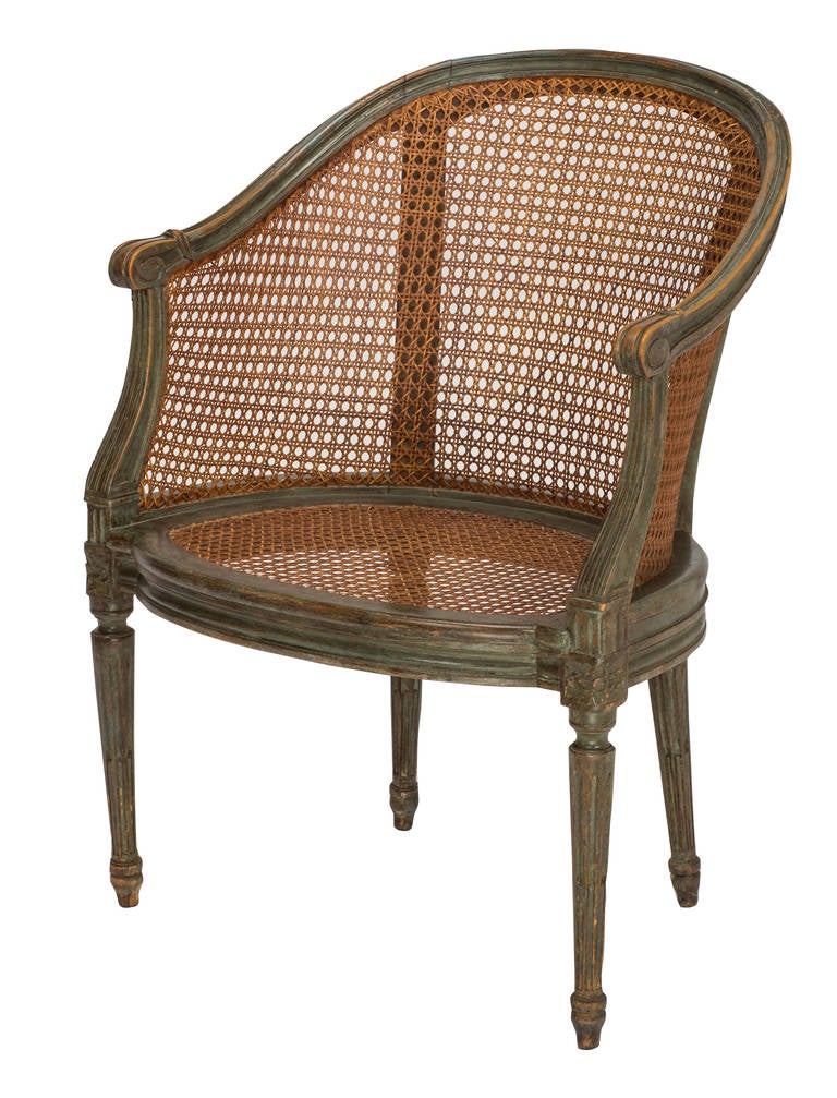 C.1930s barrel back Louix XVI style cane chair.  Paiinted green, aged through the years adding charm to this simple French chair.  Nice pull up next to your sofa.  10/8