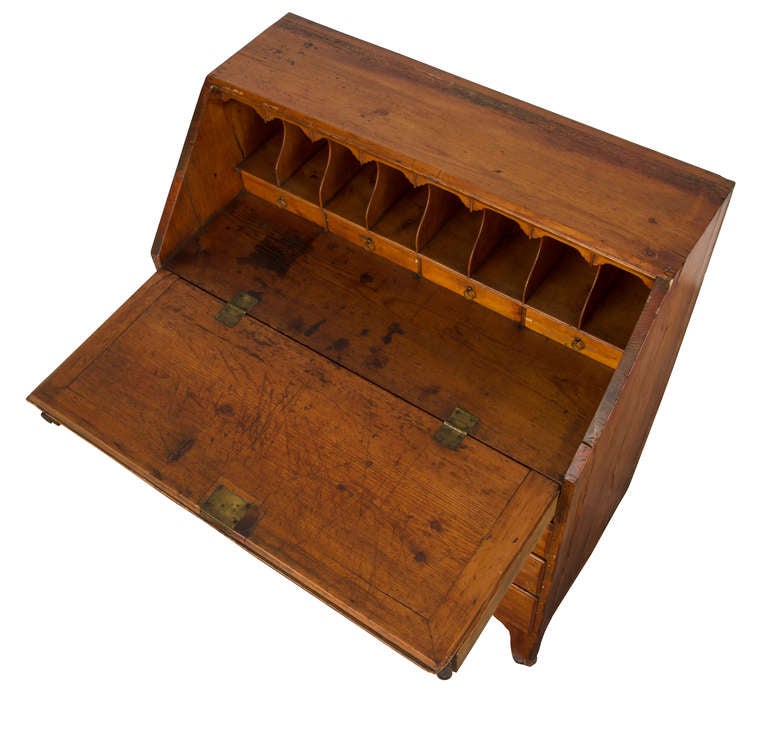 Simple but charming desk secretary made from pine wood.  Flip down desk top with mail slots, drawers for organization.  Also four graduating drawers below for storage.  All the drawers are lined with red French  fabric.