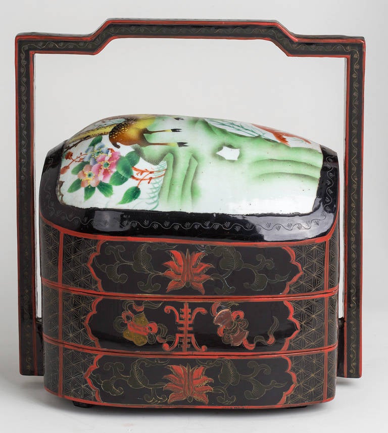 Two tier food carrier with decoratively painted porcelain dome lid.  Handle and the box is beautiful lacqer work.