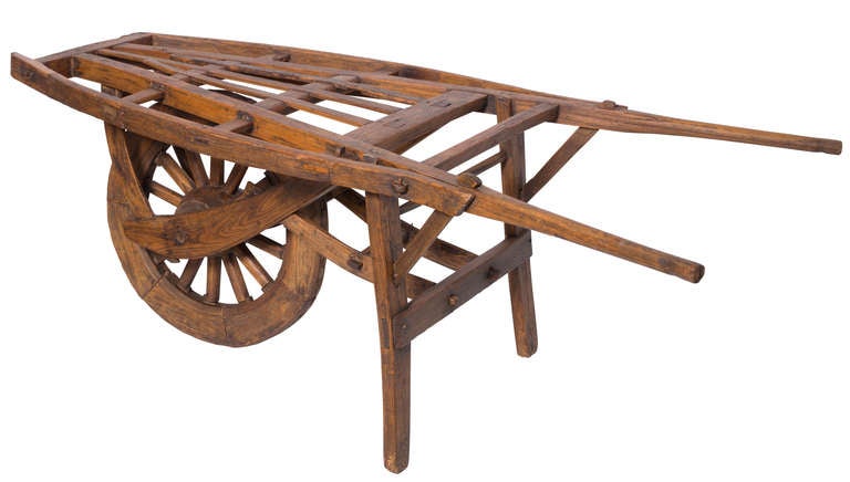 Early 1800s beautiful primitive flower cart.  All bear wood, wonderful patina.  The single wheel is put together in sections. So well restored, could be used indoor or outdoor.