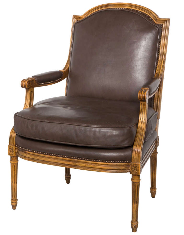 Superb quality leather.  Custom wood frame chair finished trim in antique brass nail studs.  Back covered in contrasting silk plaid.  Very comfortable and roomy.
Complimentary shipping included. graceowen@cox.net
