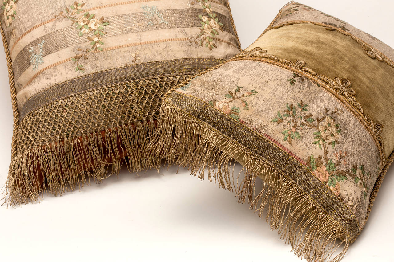 Decorative pillows made from French textiles from 1880s. Beautiful textile work made from silk and velvet, metallic thread fringes. All down fill. Large Pillow is 22 W X 12 D X 6 H. Smaller Pillow is 15 W X 10 D X 4.5 H.