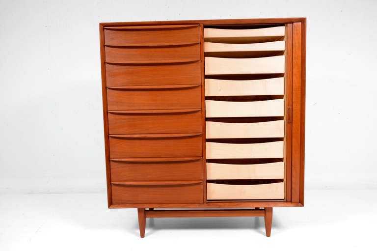 For your consideration a tall dresser made by FALSTER in Denmark, 

Constructed with teak wood. Mounted in solid teak wood frame. Features 16 pull out drawers. All of them constructed with double dove tail joints, running smoothly in wood rails.