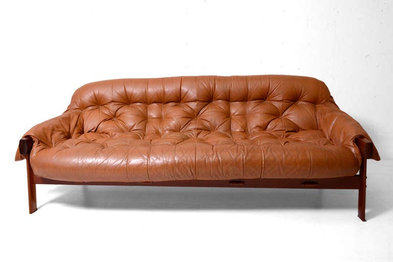 For your consideration a vintage Percival Lafer sofa. 

Seats three very comfortable. 

Frame constructed with solid Jacaranda Rosewood. Leather in carmel color has the original vintage wear. All leather straps have been replaced with new ones.