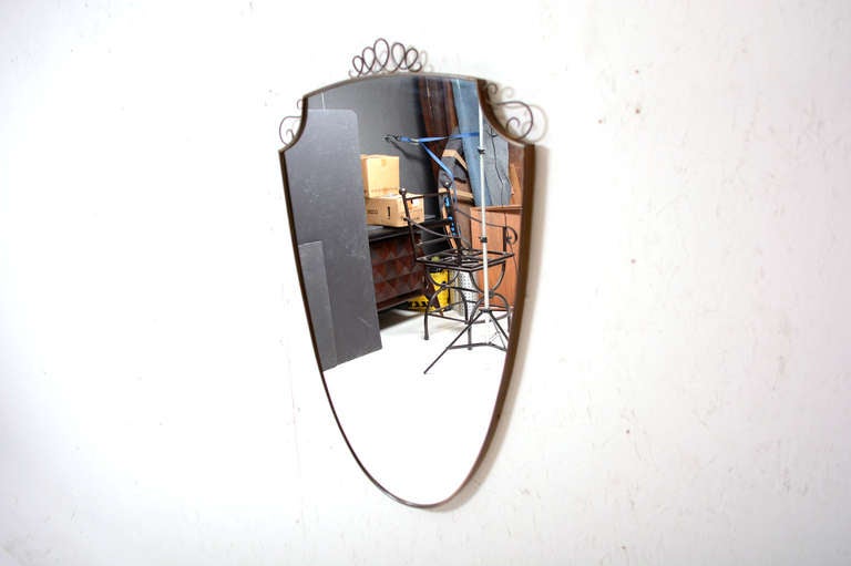 For you consideration an Italian mirror with brass frame and accent decor.

Beautiful condition with original vintage patina. 

Back is made of solid wood frame with original hook to hang into the wall.

 