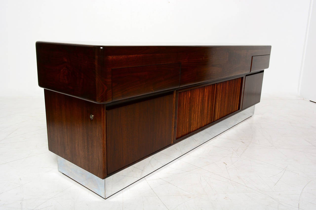 For your consideration a modern credenza constructed with walnut and burl wood. Mounted in a solid walnut base with mirror-plated stainless steel base.

Two small drawers on top and two large file drawers in bottom, open with ease. 
All drawers
