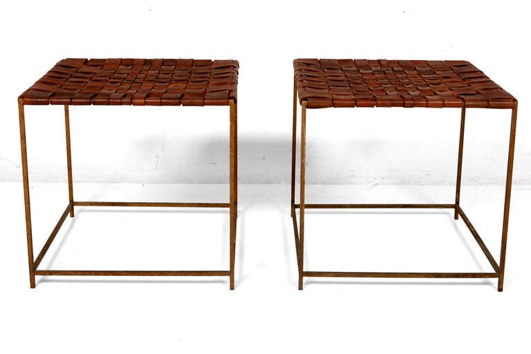 For your consideration a pair of stools or side tables.

Constructed with iron frame and leather top. 

Leather has medium brown tone and has an interested weaving pattern. 
Leather is new.

The iron frame has the original vintage patina