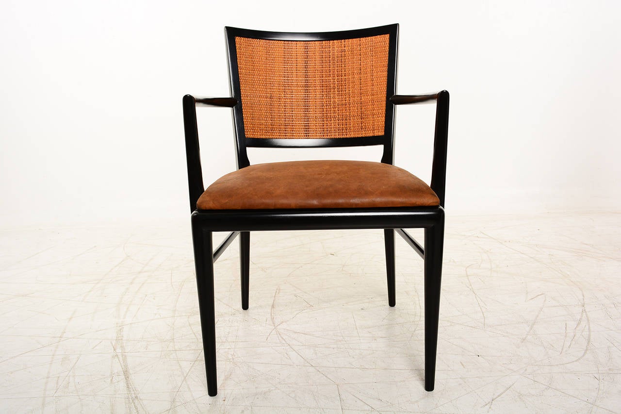 For your consideration a Mid-Century Modern armchair by Brower Furniture.
Beautiful clean modern lines. Solid wood finished with black lacquer. Original cane backrest and new leather / foam for the seat.

Original stamp from the maker underneath.