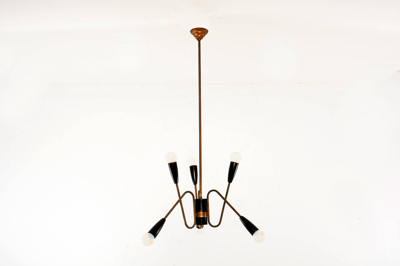 For your consideration a vintage Italian chandelier with sculptural arms. 

Three arms with two bulbs per arm. Requires E-14 bulb. 
Lamp is vintage with vintage patina. Rewired and ready to go. 

Brass and aluminum (painted in black).
No