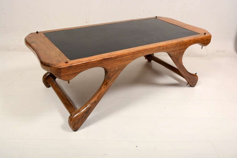 For your consideration a vintage coffee table by Don Shoemaker. 
Cocobolo wood with leather top. No label from the maker present.