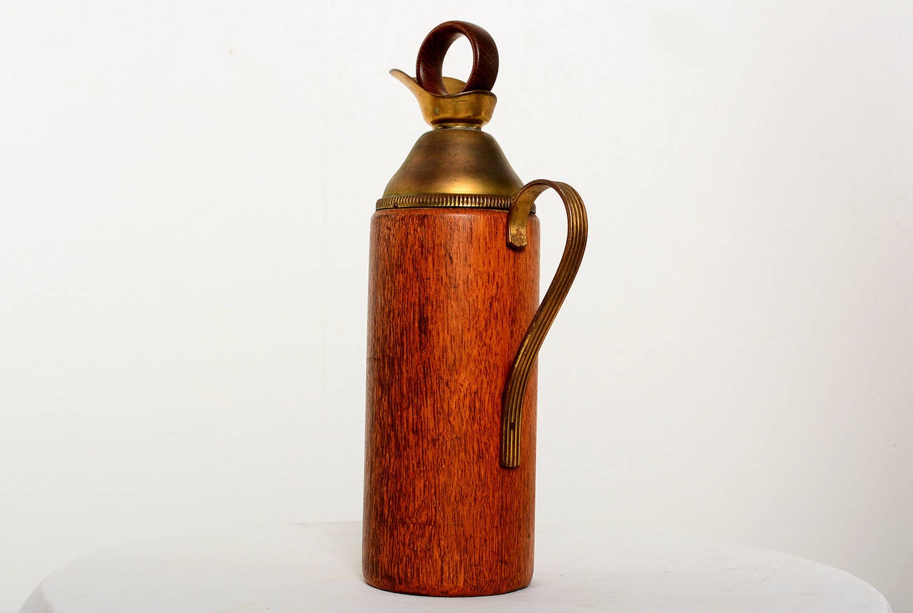 For your consideration a vintage pitcher by Aldo Tura.
Brass and teakwood.

Unmarked.