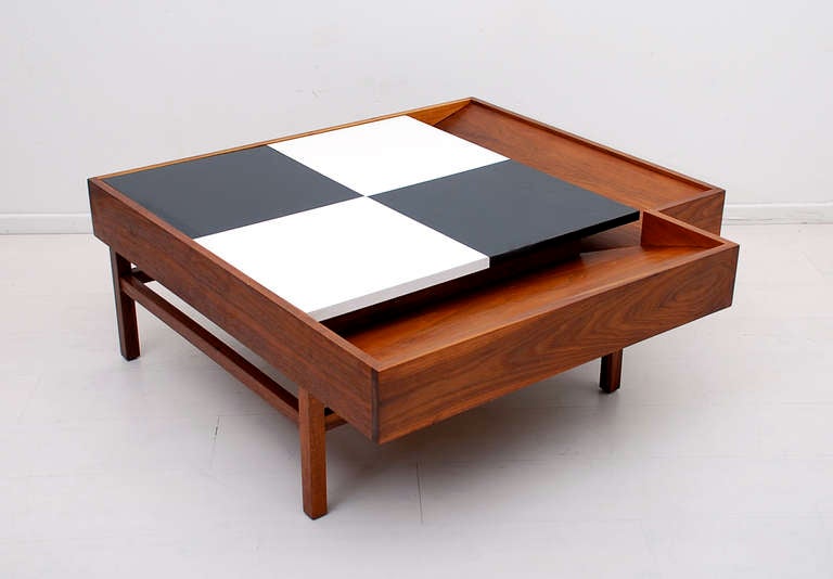 One of kind and hard to find checkered coffee table designed by John Keal for Brown Saltman. Solid walnut wood with slight angle for magazines and hidden storage compartment. Top constructed with black and white formica. Label from the maker inside