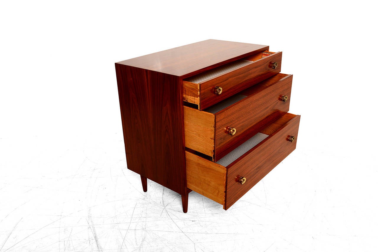 For your consideration a three pull out single dresser by Glenn of California. 
Sculptural pull out handles. All drawers are constructed with double dove tail joints.  

Mounted in peg legs. 
Stamp from the maker and retail shop 
