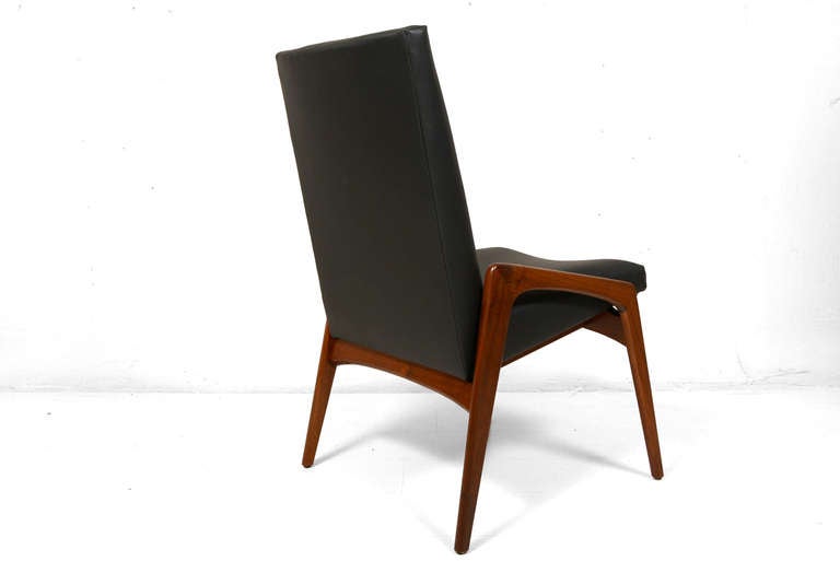 For your consideration a set of six dining chairs by Glen of California.  Sculptural seat in faux leather (black color) with solid walnut frame.  Very rare set to find.