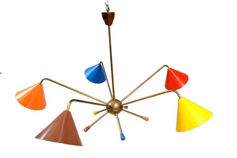 For your consideration a multicolor italian chandelier. 

Brass body with original vintage patina. Five arms with spoon aluminum shades  in different colors. Shades have been re-painted. 

40 bulb watt recommended. It requires E-14 european bulb.