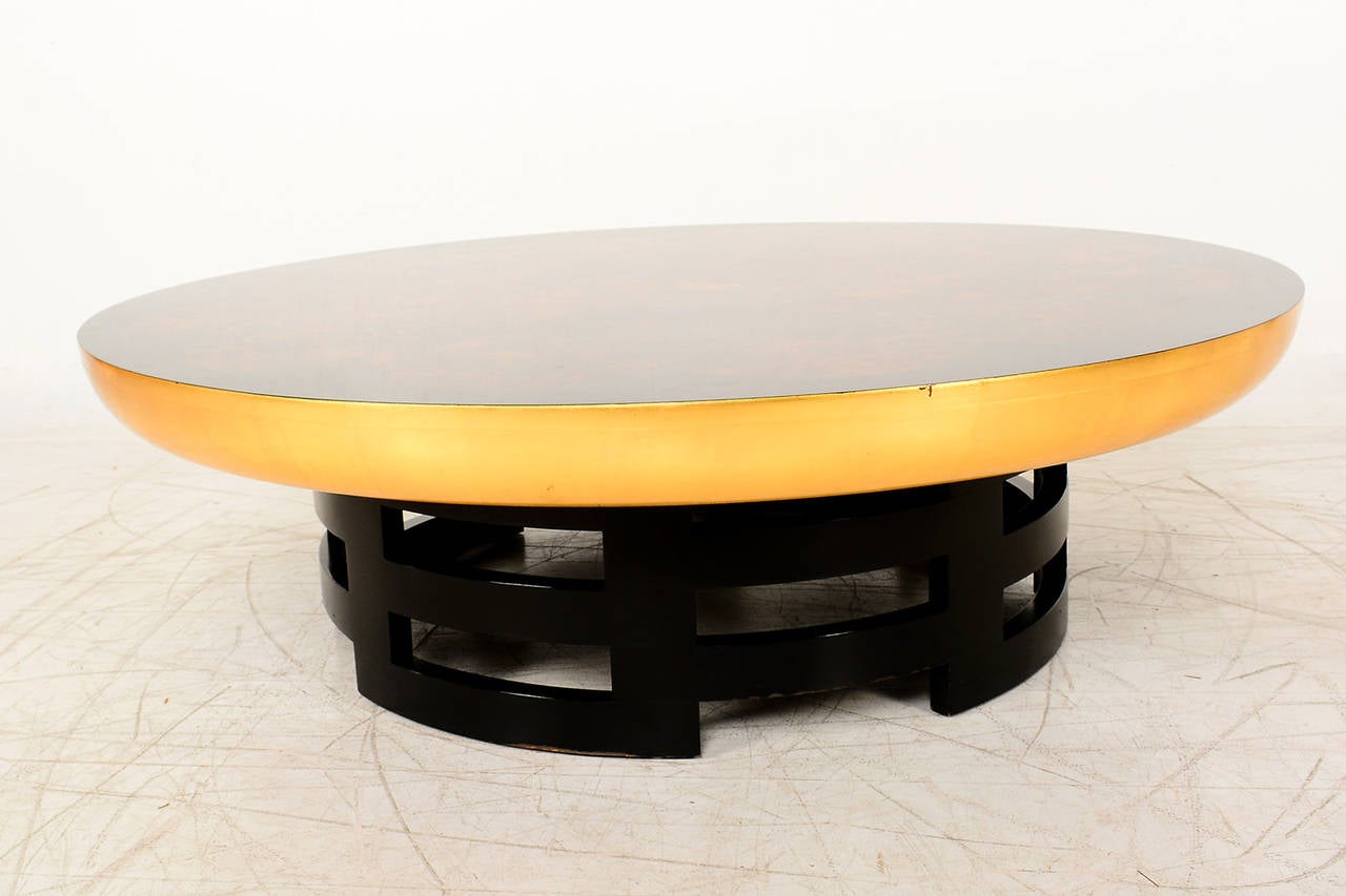 For your consideration a vintage mid-century modern Lotus Coffee Table. 
Faux tortoisehell with gold leaf bad on the side.

Original vintage condition. Expect gentle vintage wear.
