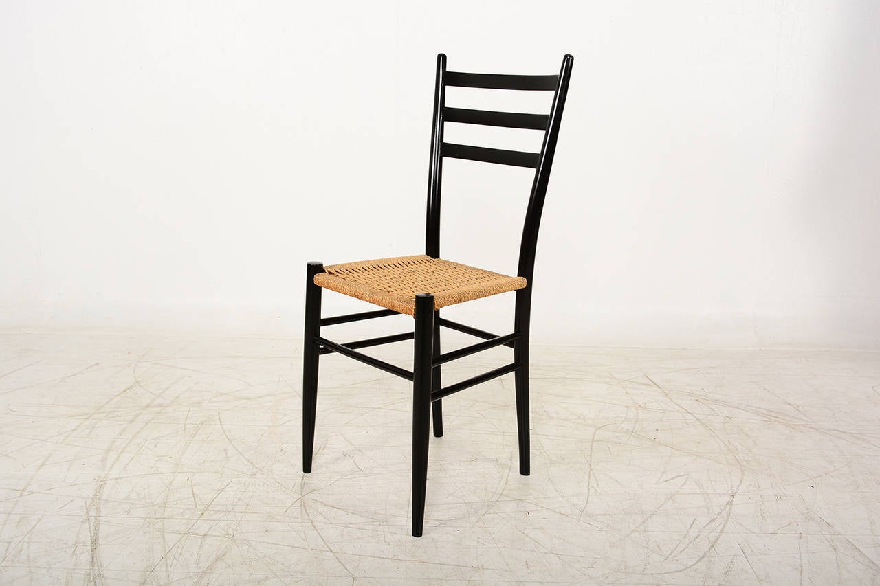 For your consideration a vintage Italian side chair. Ebonized wood with original weaved rope. 
Unmarked.