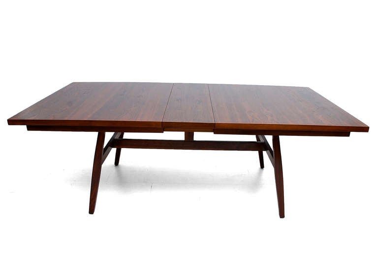 For your consideration a beautiful walnut dining table with two extensions. Sculptural clean modern lines. Firm and sturdy. 

Stamped underneath with Glenn Label. USA 60s. By Milo Baughman.
Table has two extensions 12