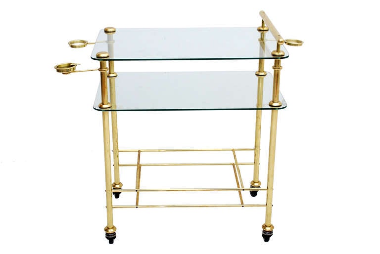 For your consideration a vintage service cart in brass with glass. Unmarked, Mexico, circa 1950s.