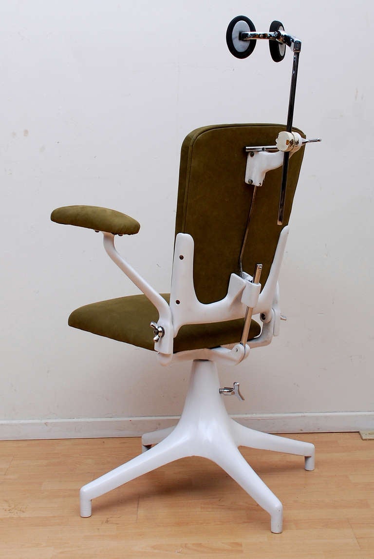 For your consideration a vintage dentist chair, restored. Cast iron fame, new chrome plated hardware. New olive color leather. Fully working condition. Great vintage piece