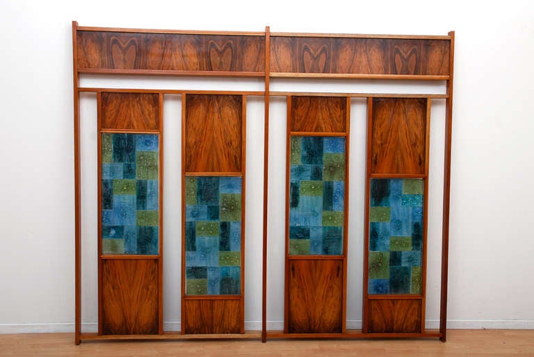 For your consideration a room divider constructed with mahogany wood, exotic wood and glass colored tiles. 
The glass tiles are handmade. The colors range from dark blue, light blue and light green color. 

The screen can be split in two parts