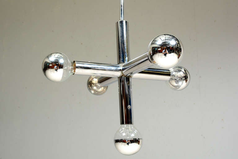 Chrome plated hanging fixture  by Robert Haussman. 
Five bulb chandelier with chrome plated steel body.