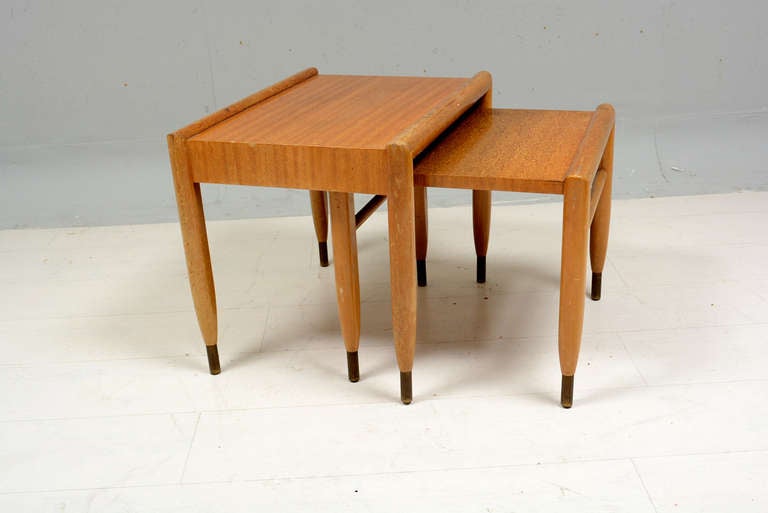 For your consideration a set of two nesting tables by John Keal for Brown Saltman. Mahogany wood with brass accents.