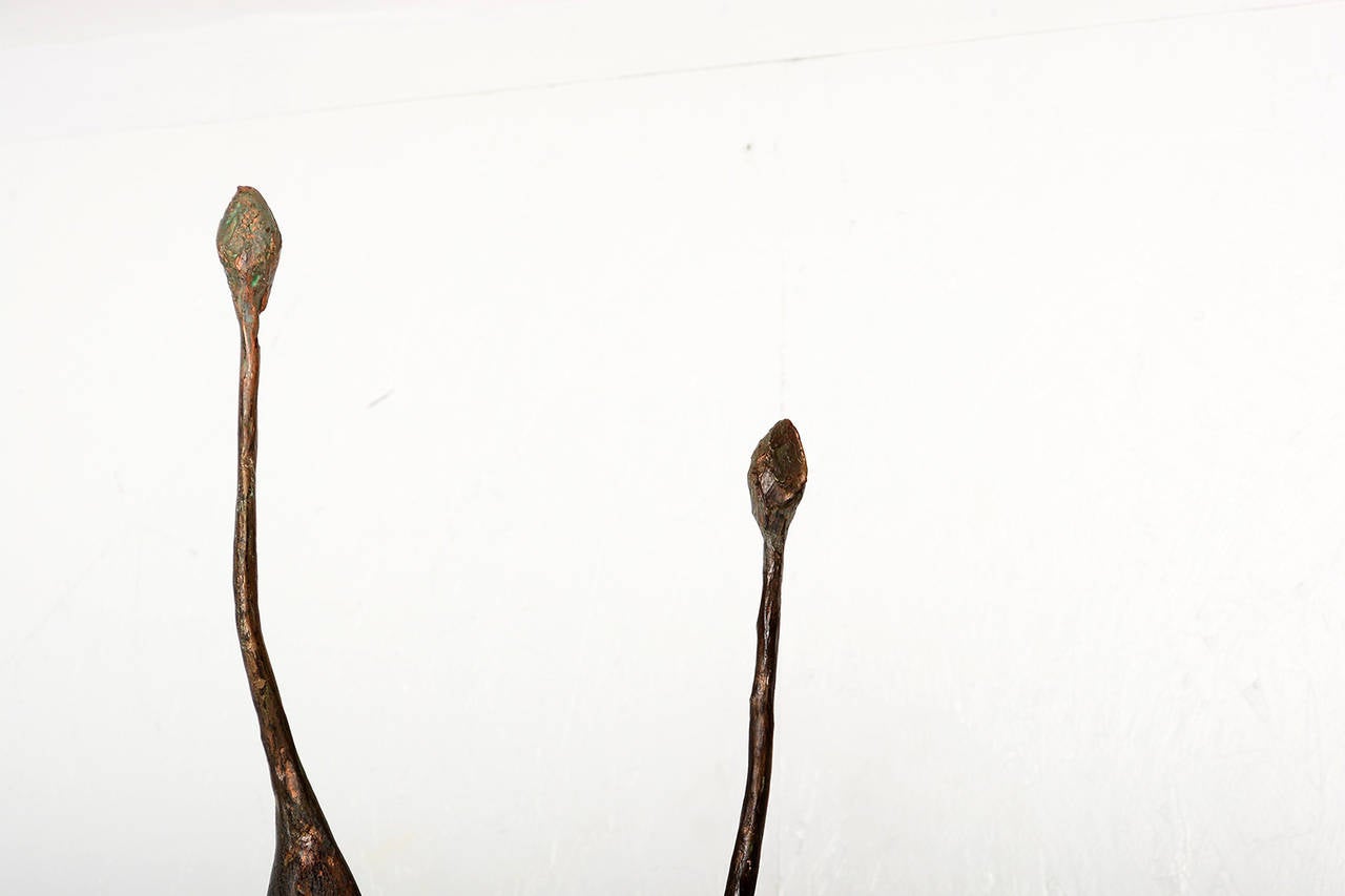 For your consideration an abstract sculpture unsigned. Faux bronze. Man and women in the style of Giacometti.