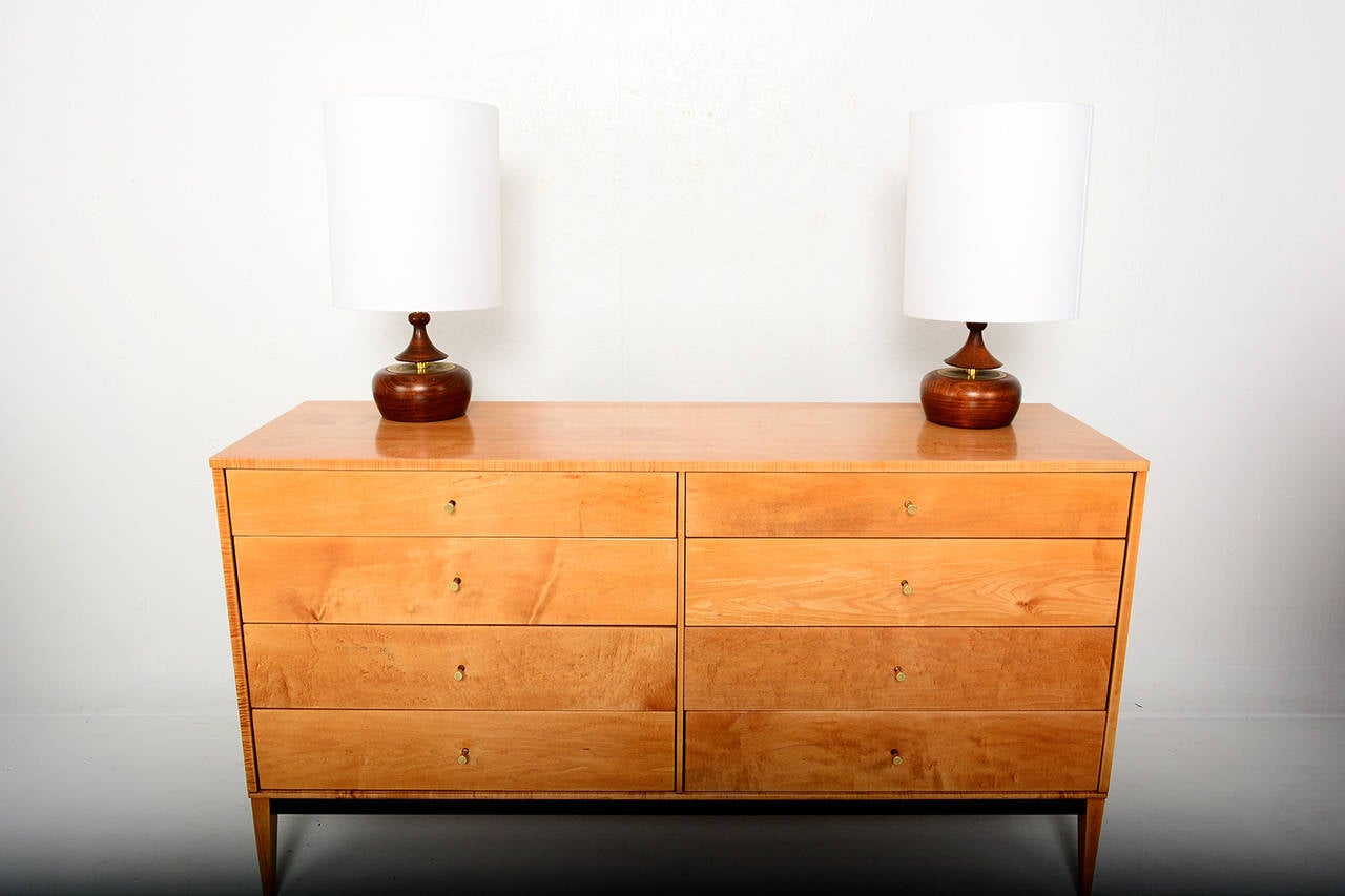 For your consideration a double dresser designed by Paul McCobb for the PLANNER Group. Solid wood with iconic brass handles.

Eight (8) drawers constructed in solid wood with double dove tail joints. Firm and sturdy. 

All drawers open and close