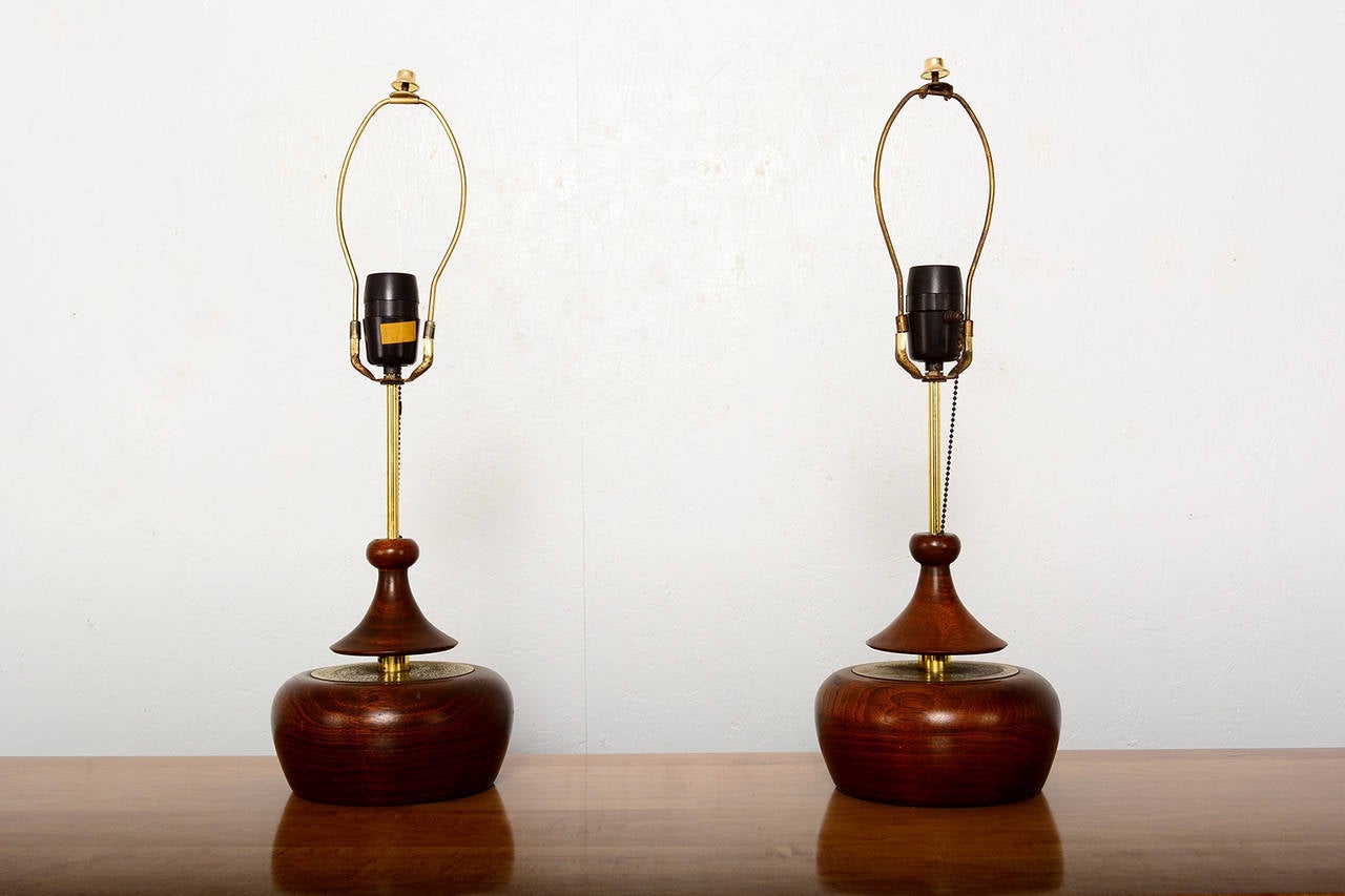 For your consideration a pair of sculptural table lamps constructed with walnut wood and accent brass. Shades are for display purpose only. Not included.
Beautiful accent pieces which provides soft ambient lighting. 
Shade is 12