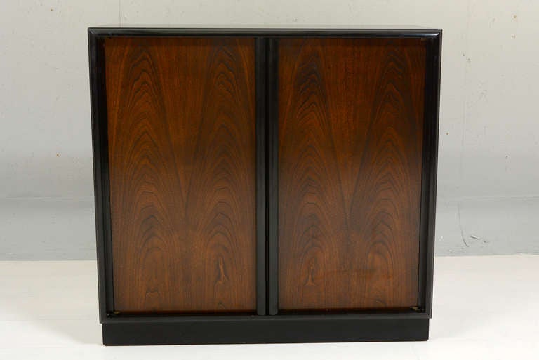 FOr your consideration a mid-century modern cabinet designed by Robsjoh Gibbings for Widdicomb. 

Walnut door with ebonized body.