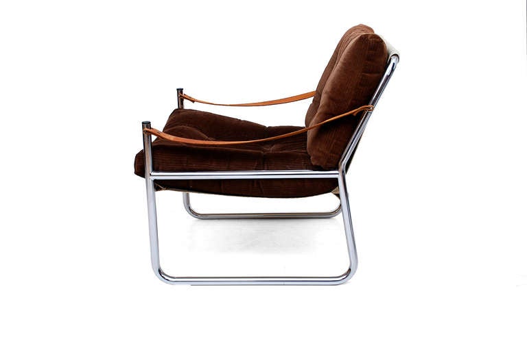 One of  a kind safari lounge chair with chrome plated tubular frame. Light egg shell canvas and brown corduroy upholstery with tan leather arm straps. 

Cushions are removable.

No information on the maker. Attributed to scandinavian design. 