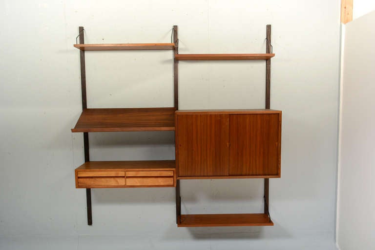 For your consideration a long Wall unit by Poul Cadovius. 

7 uprights in solid teak wood  69