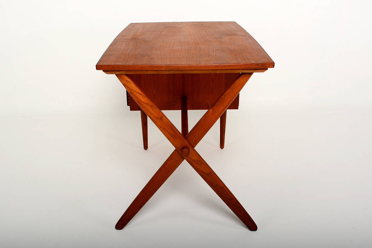 For your consideration a vintage danish modern desk. Features three pull out drawers constructed with double dove tail joints and a writing table on the left side. 
