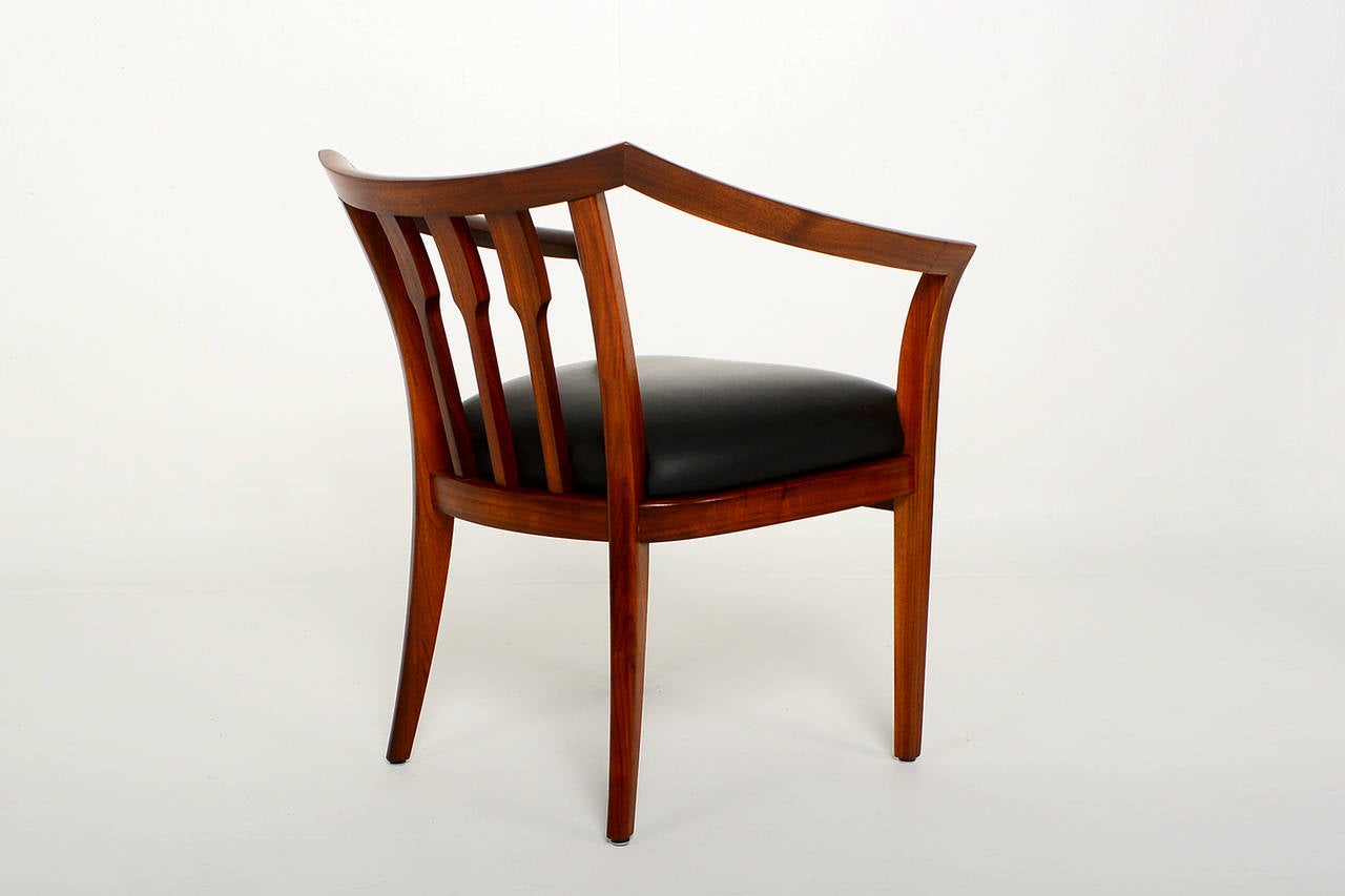 For your consideration a custom set of four chairs constructed in solid walnut wood. Unique design with curved arms and backrest. Chairs are very comfortable.