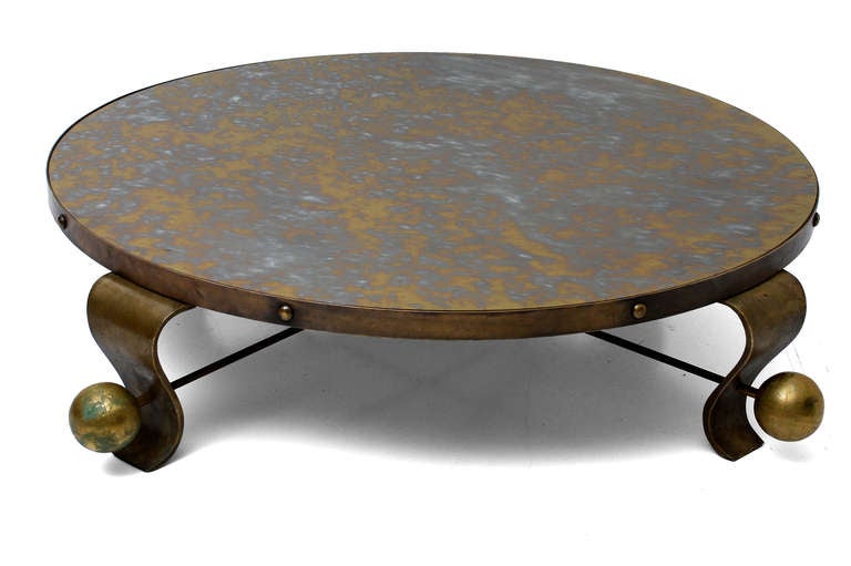 For your consideration a very rare round cocktail or coffee table by Arturo Pani. 

Sculptural legs with original eglomized mirror top.