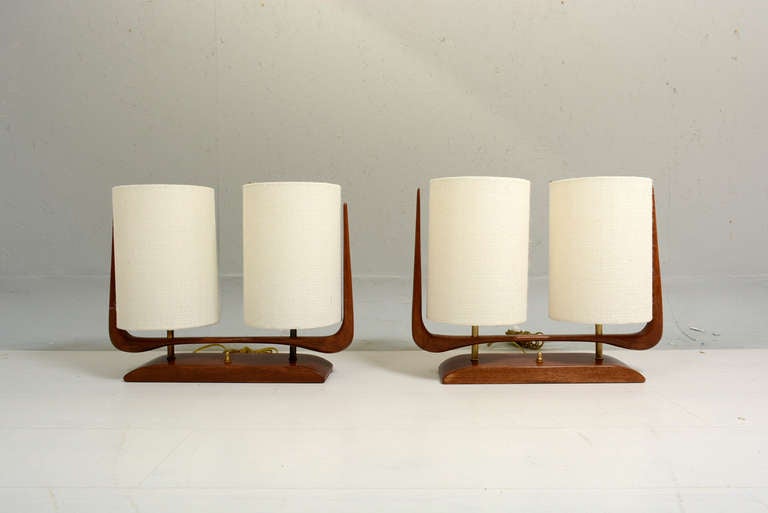 For your consideration a pair of sculptural table lamps constructed with mahogany wood and double shade. 

Two bulbs per lamp.